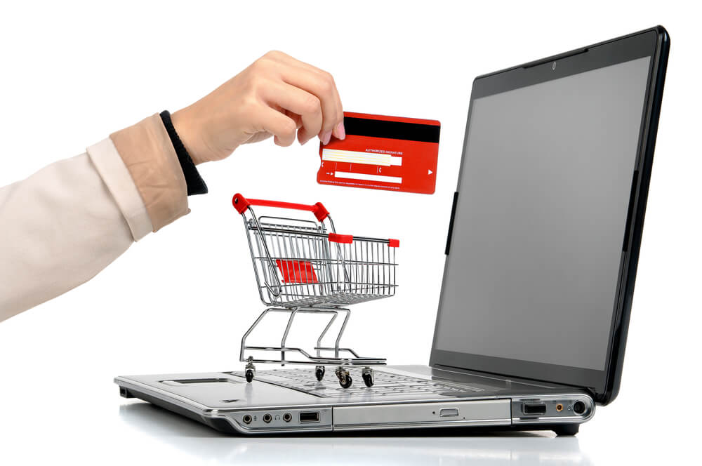 man shopping online and using credit card