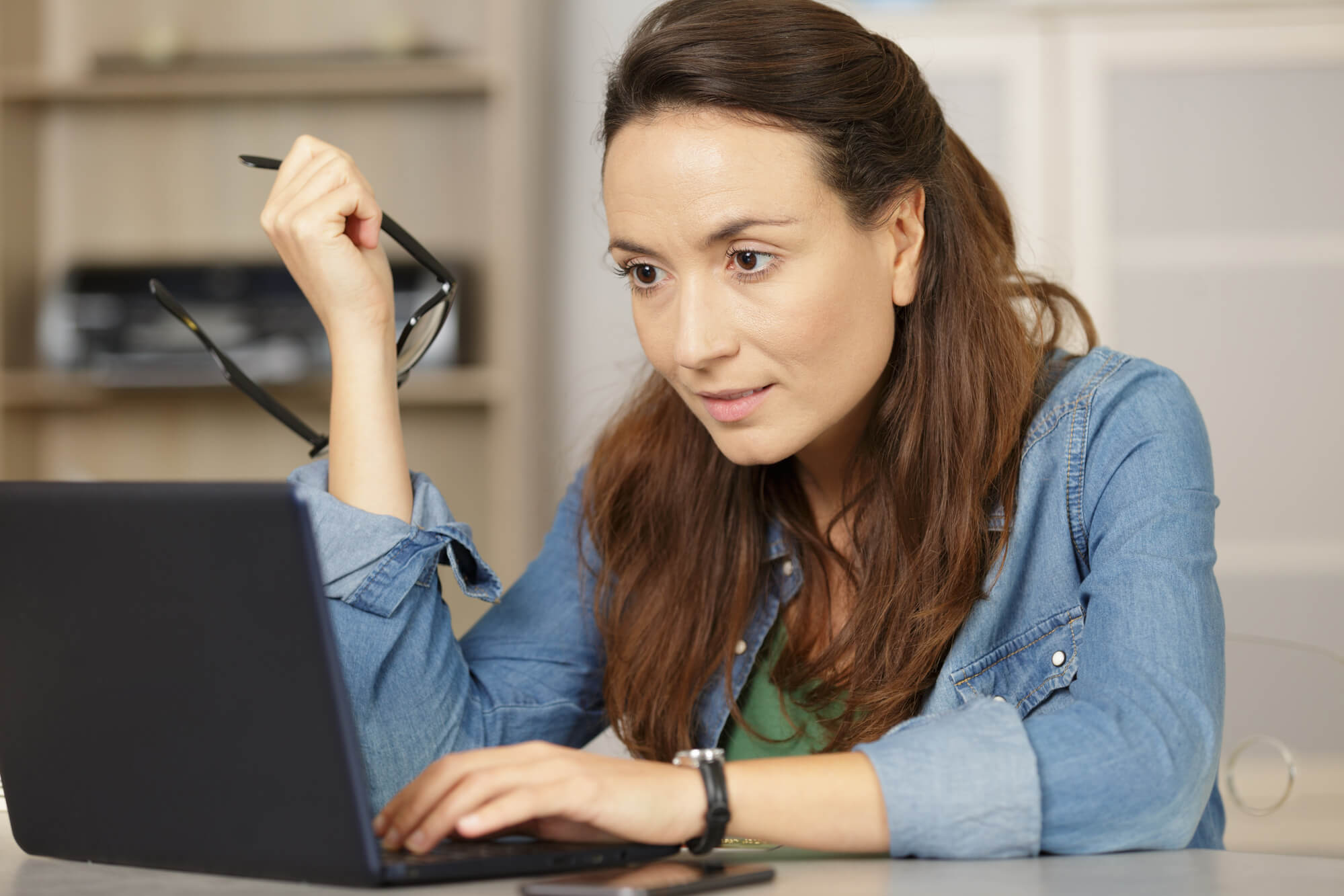 a female content writer working on her laptop