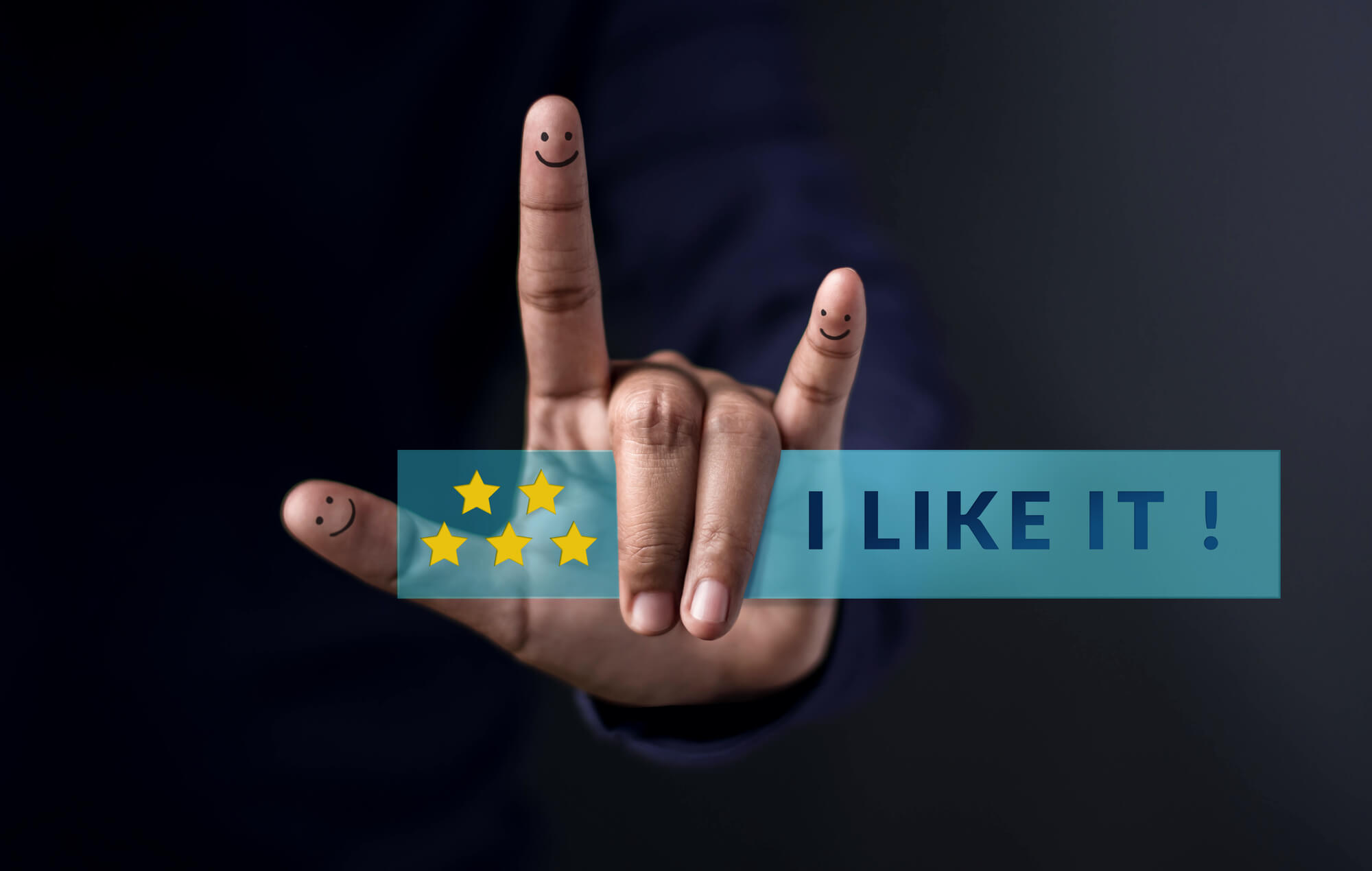 hand with "i love you" gesture holding a five star rating review