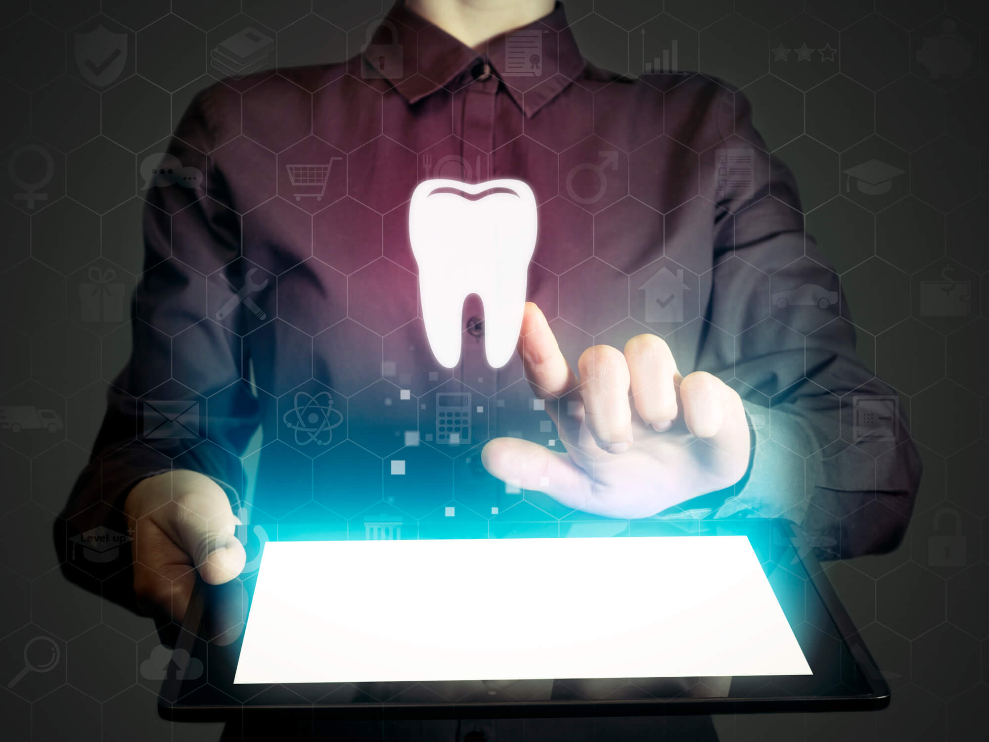 man touching image of a tooth in a mobile screen