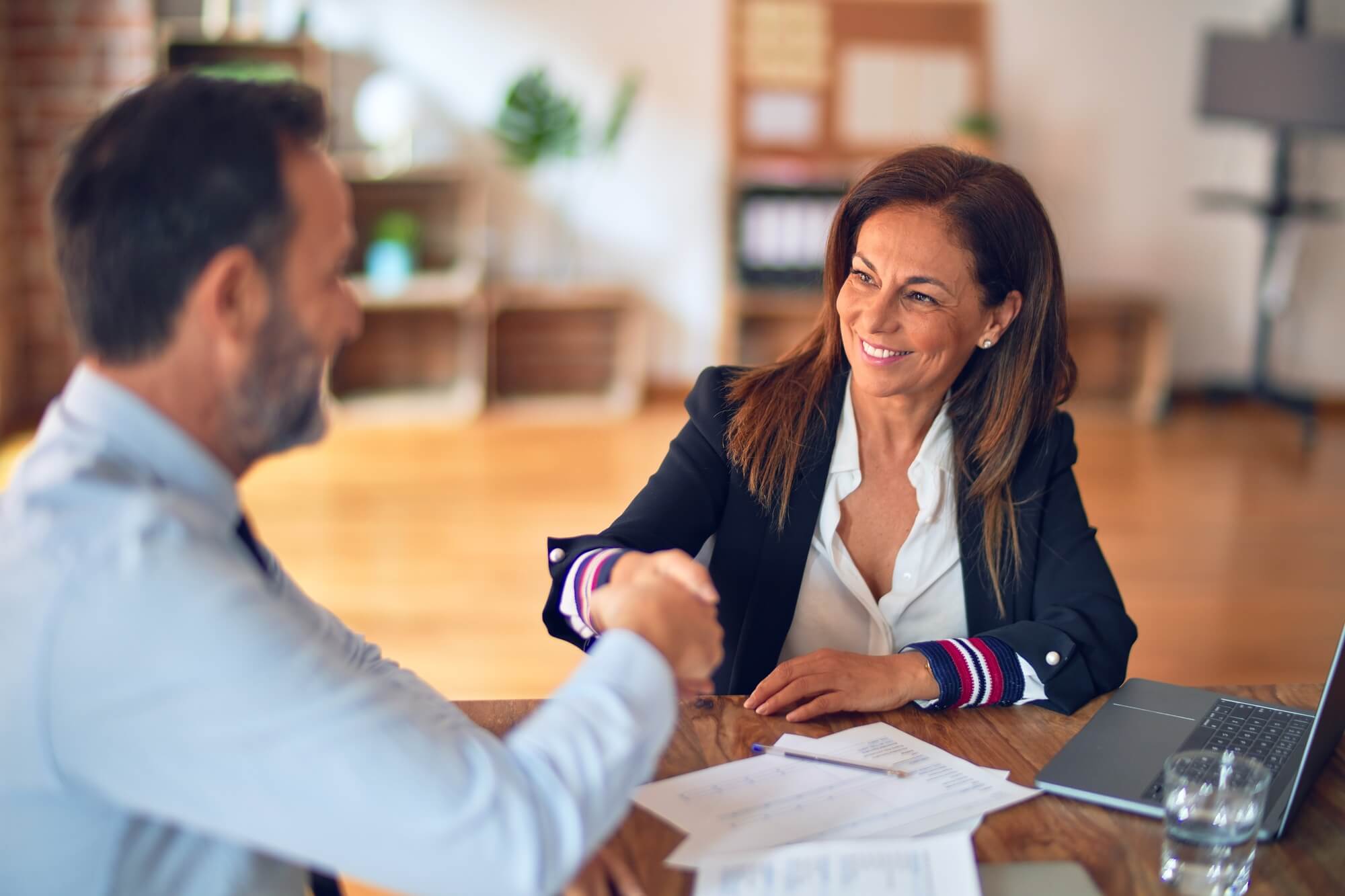 Business owner applying her new negotiation skills to win more clients. 