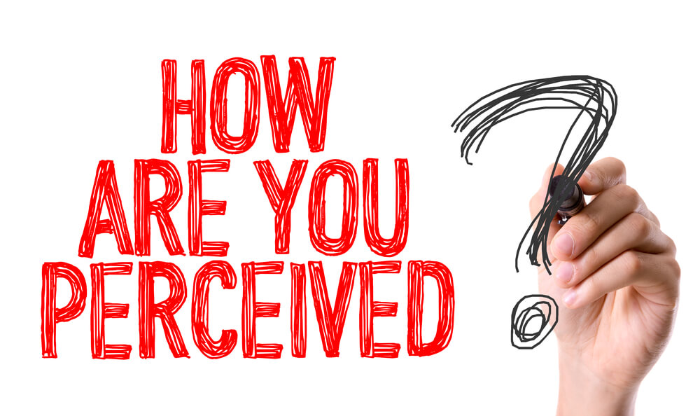 Hand with marker writing text. 