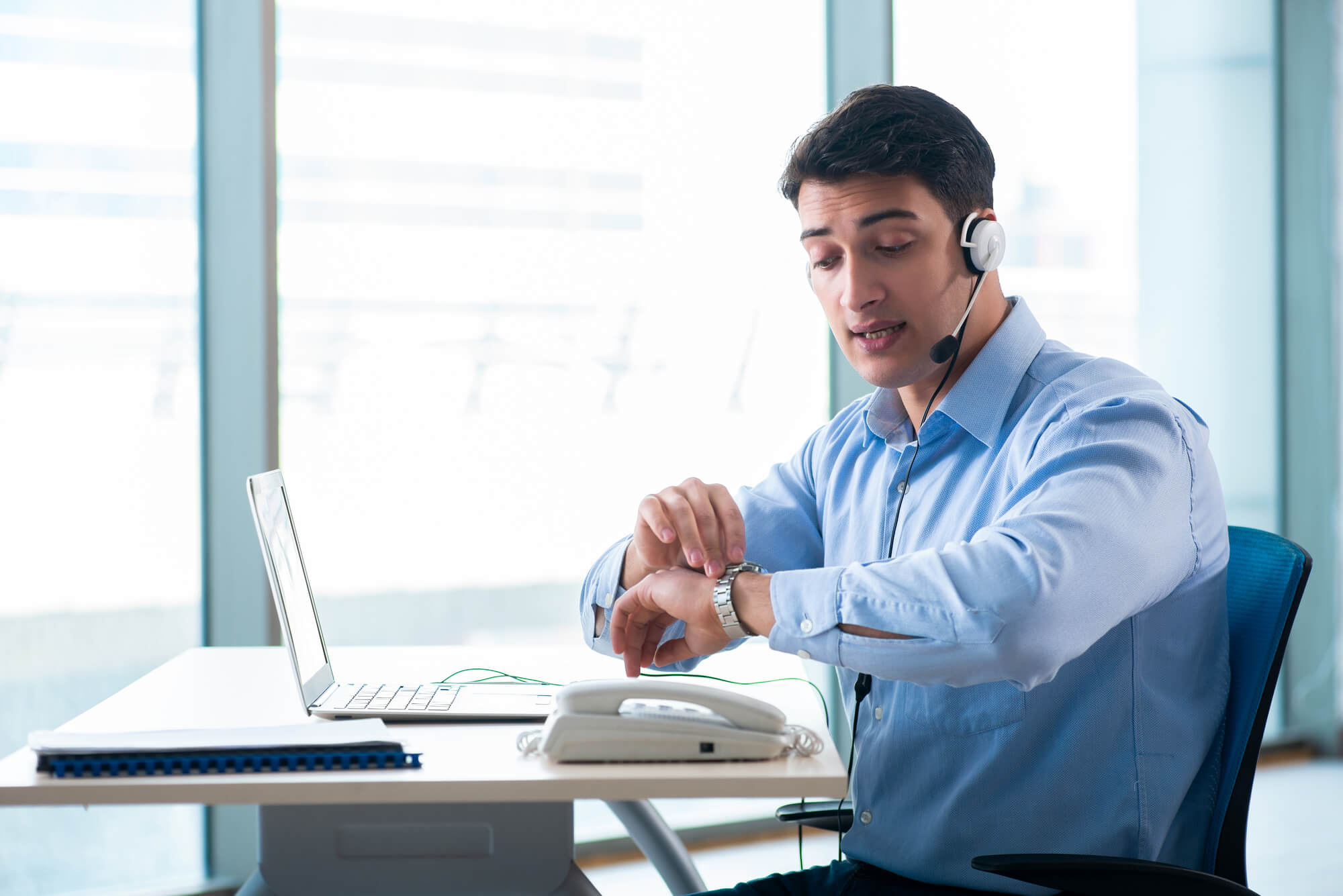 CS rep checking the time in his watch
