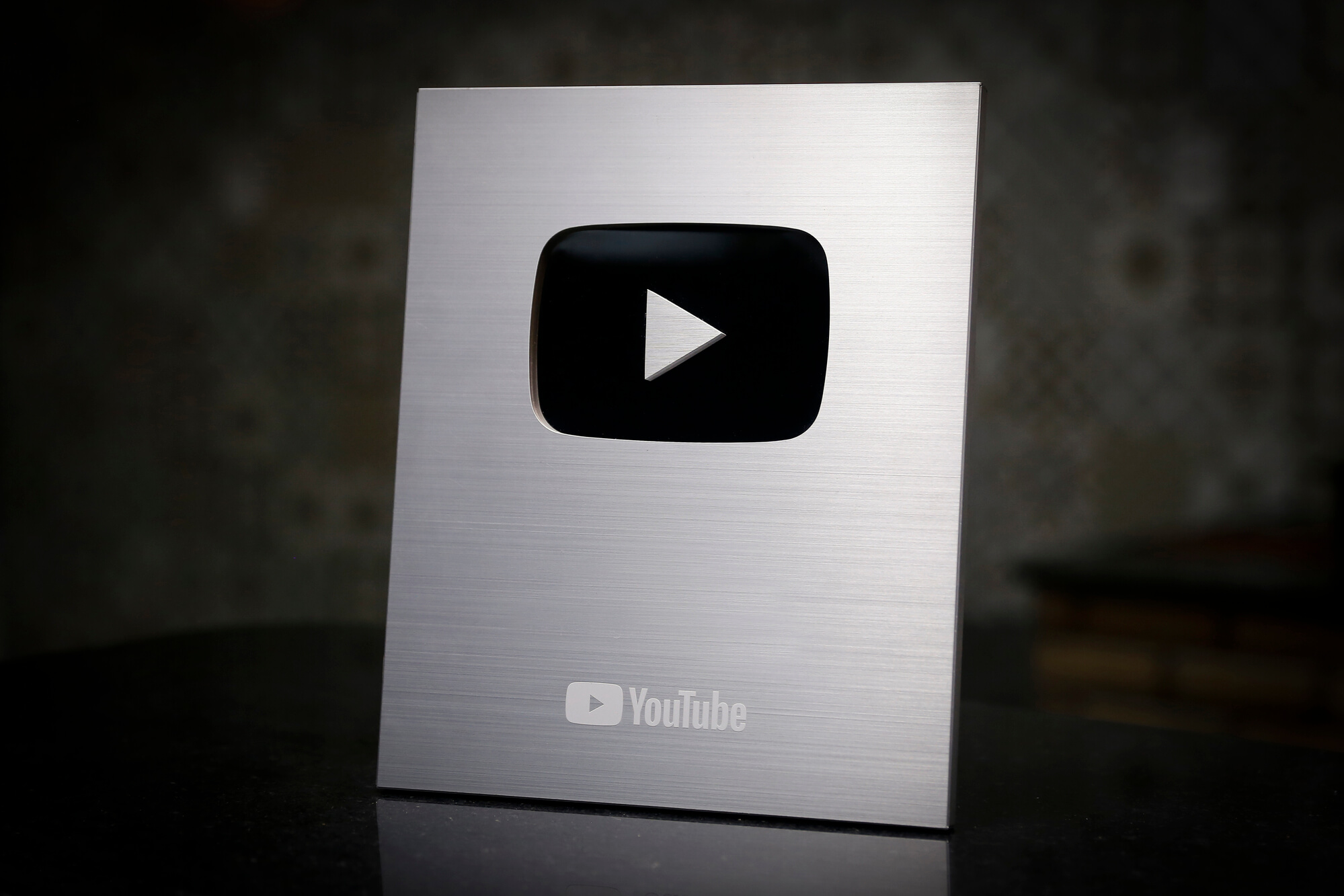 YouTube silver play button plaque. 