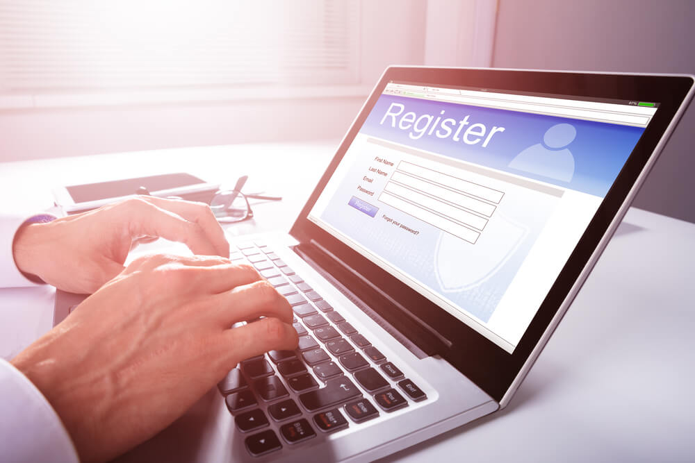 man filling online registration form on a West Palm Beach Web Design