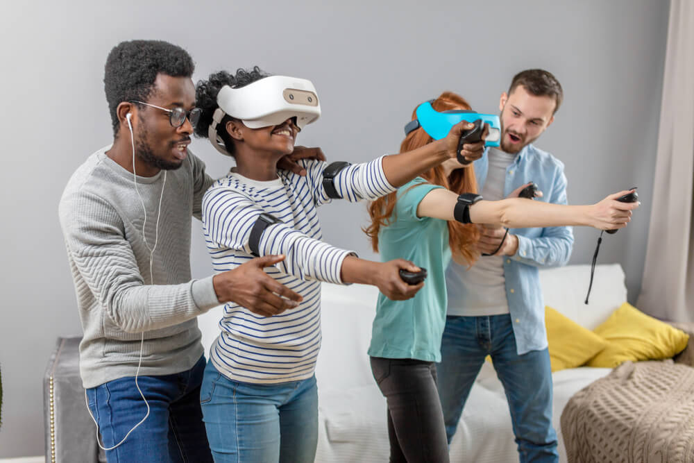 Multicultural group of friends playing games using virtual reality in local SEO in Miami