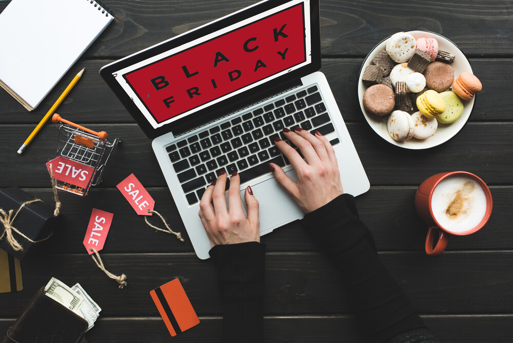 a woman looking at black Friday sale deals