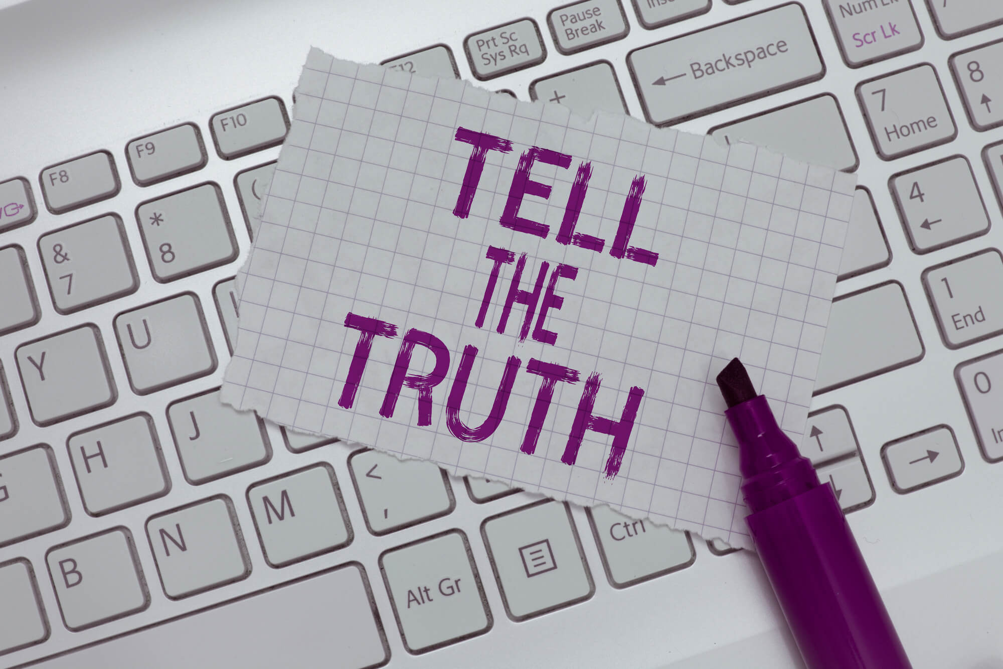 paper marked with tell the truth phrase