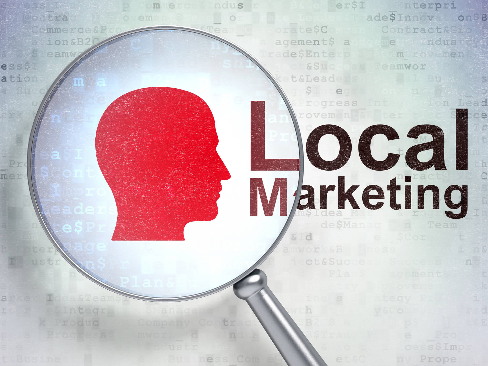 magnifying glass on drawing of a head next to local marketing word
