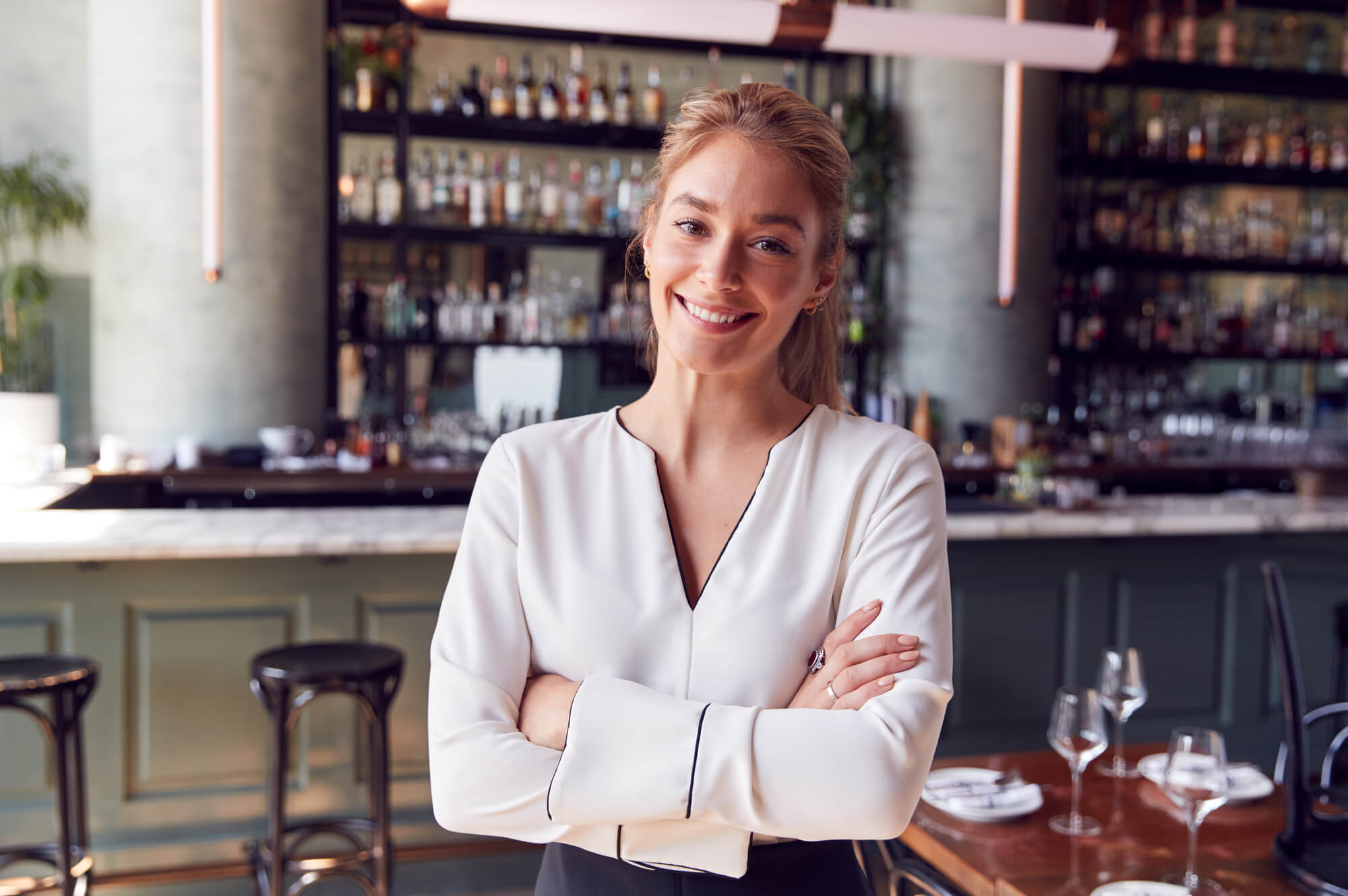 female restaurant franchise owner posing confidently