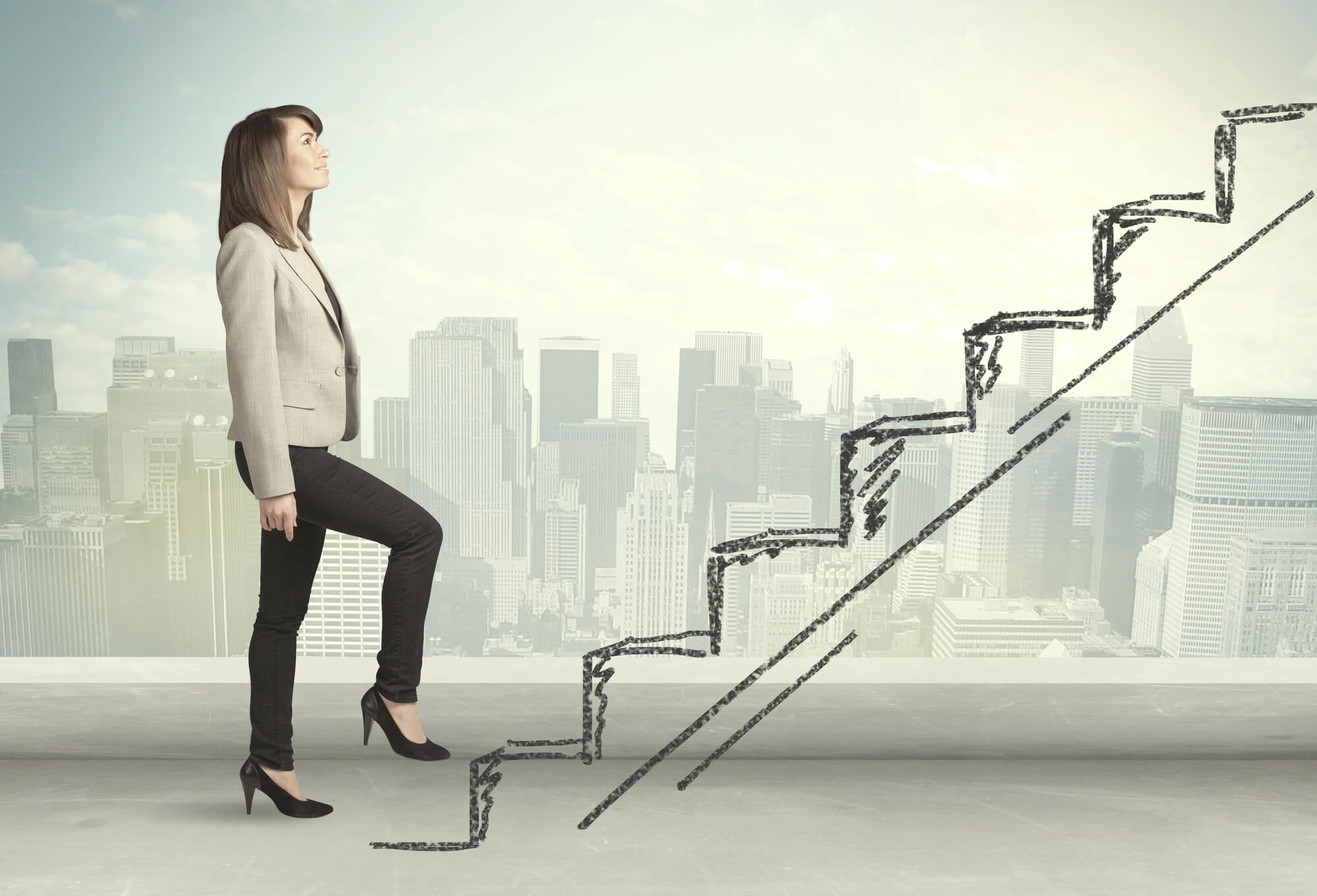 businesswoman climbing up on hand drawn stairs
