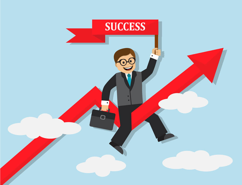 A happy and successful business man riding on an arrow that's going up