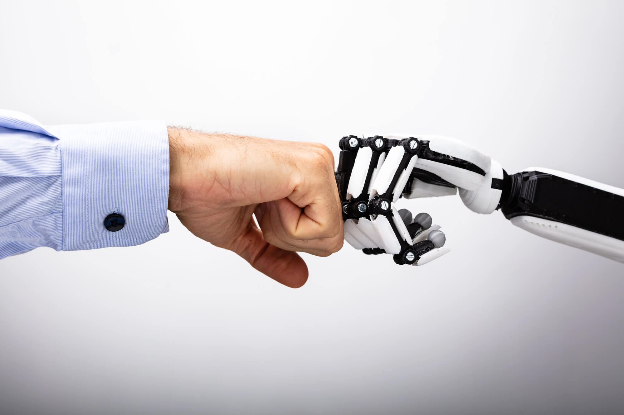 businessman and robot doing a fist bump