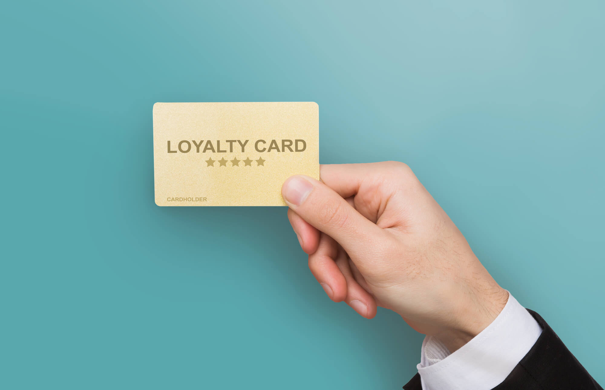 businessman holding loyalty card