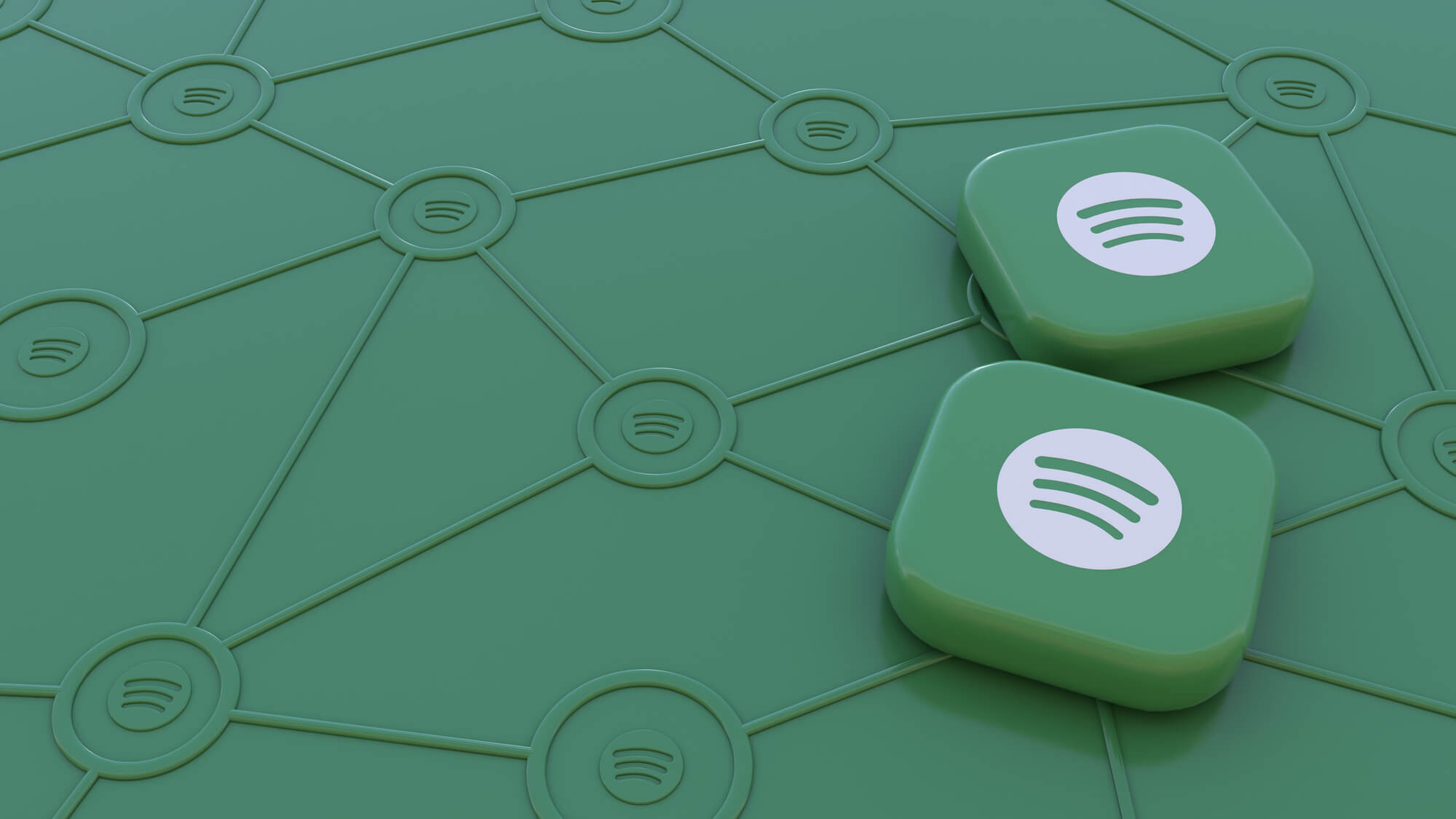 two spotify badges lying on green background