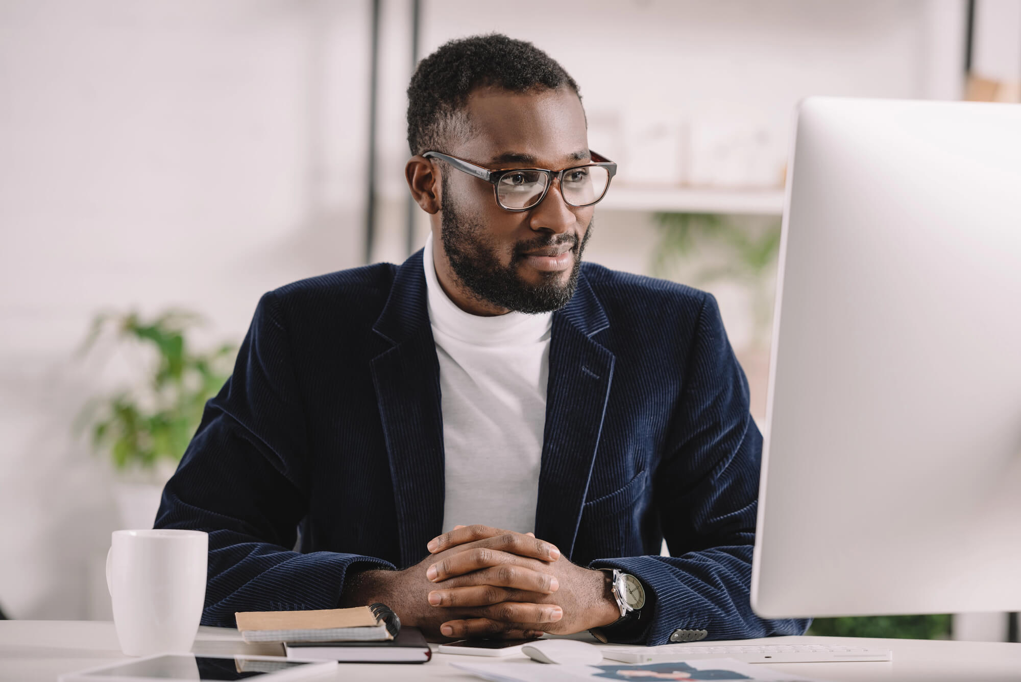 male professional studying his computer