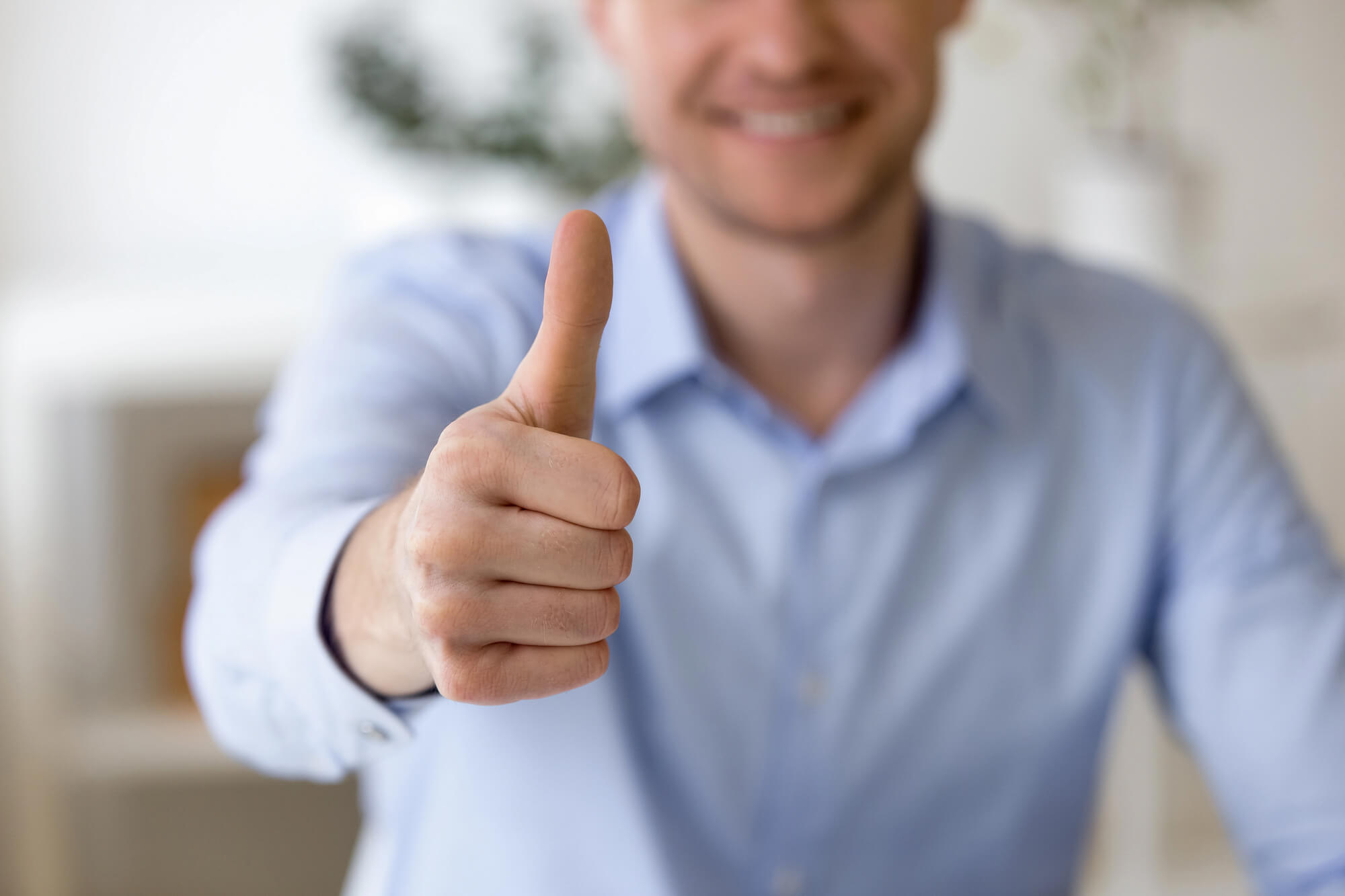 businessman giving a thumbs up