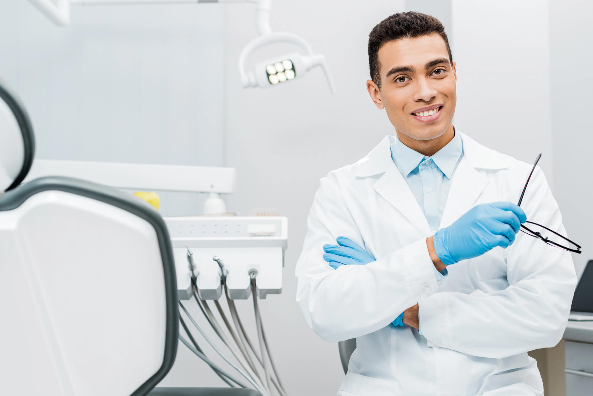 male dentist smiling with confidence