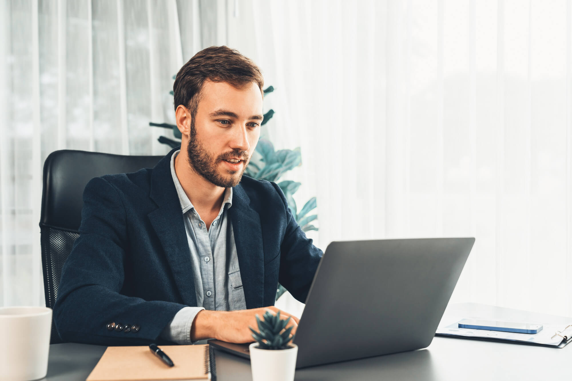 businessman exploring financing options using laptop