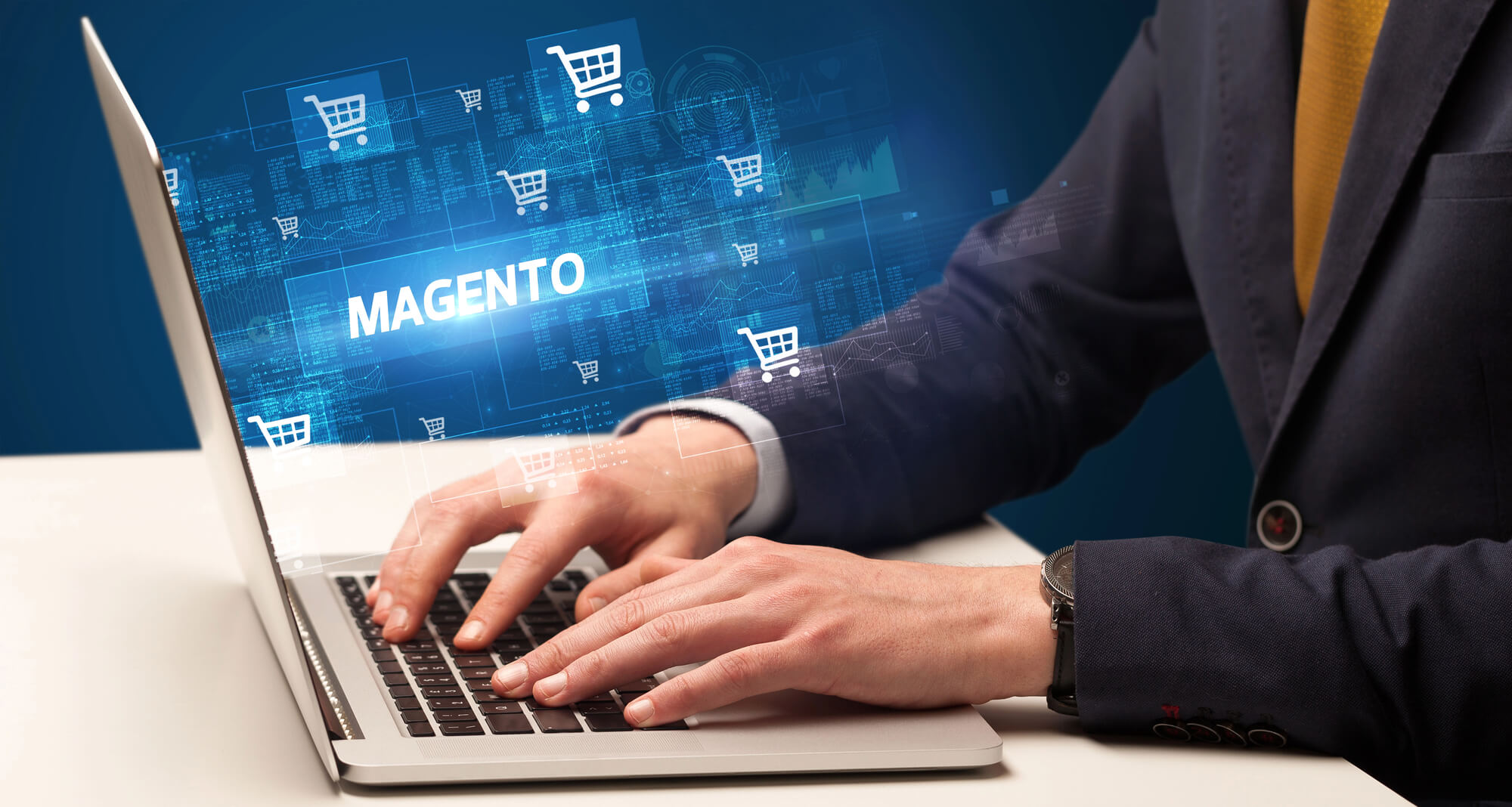 businessman managing magento on laptop