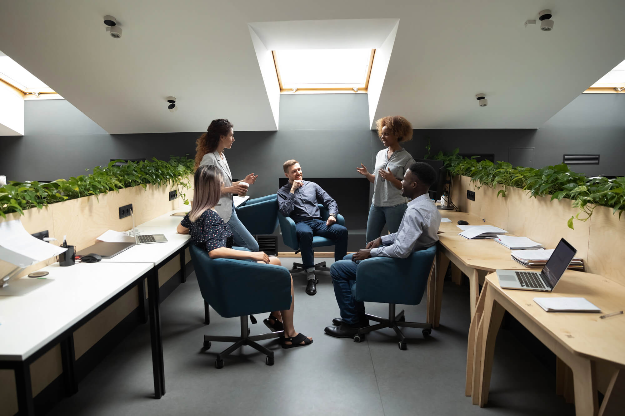 digital marketing agency nashville team members discussing ideas in a shared space