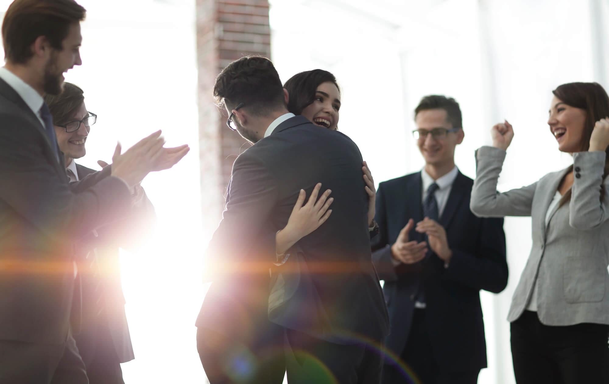 group of business people congratulating each other