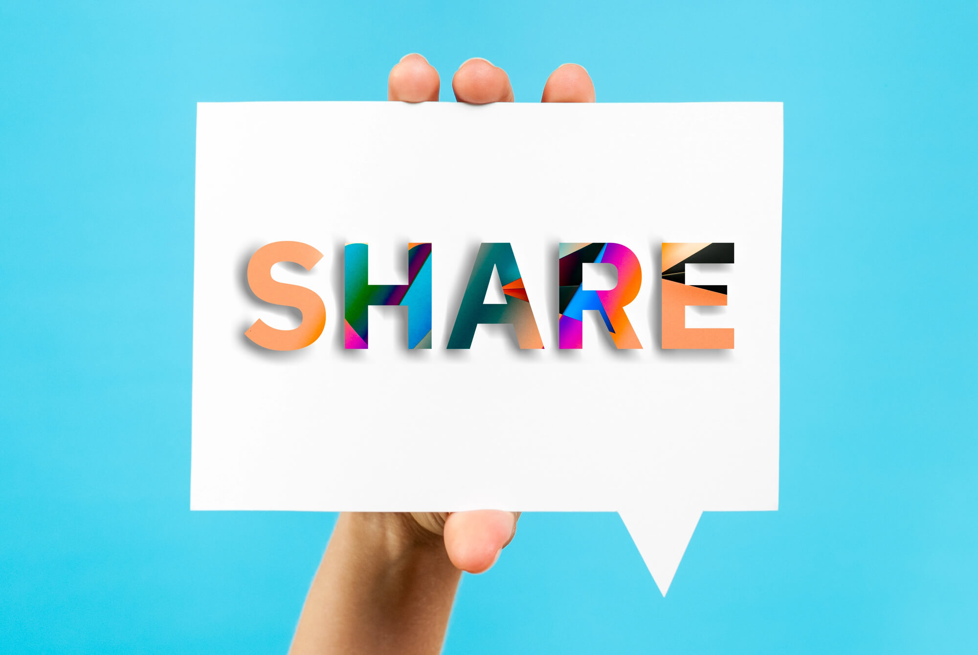 hand holding share speech bubble