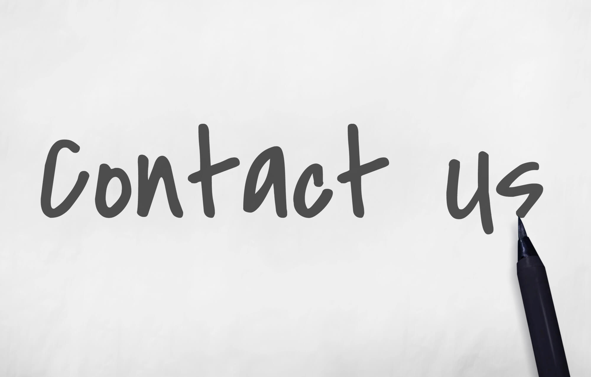 "Contact us" written in dark cursive script