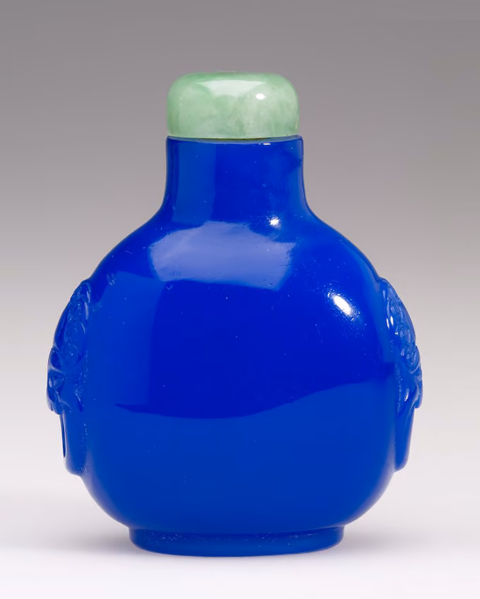 Glass with mock mask and ring handles