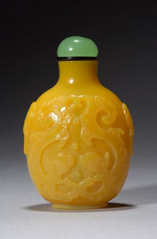 Imperial yellow glass molded with dragons