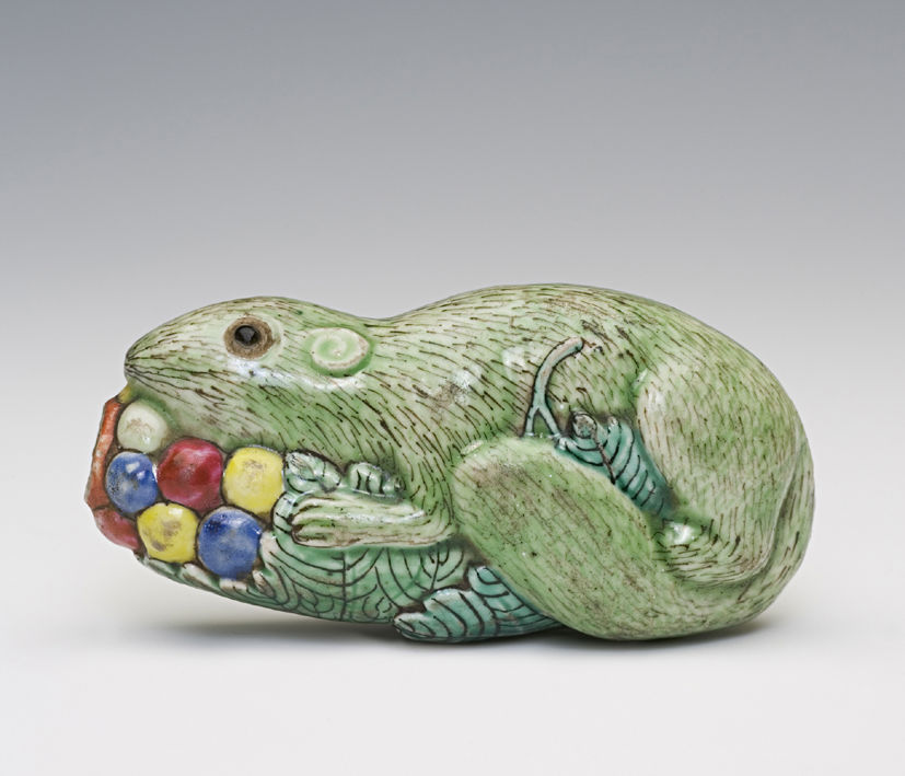Porcelain molded in the form of a squirrel on a grapevine