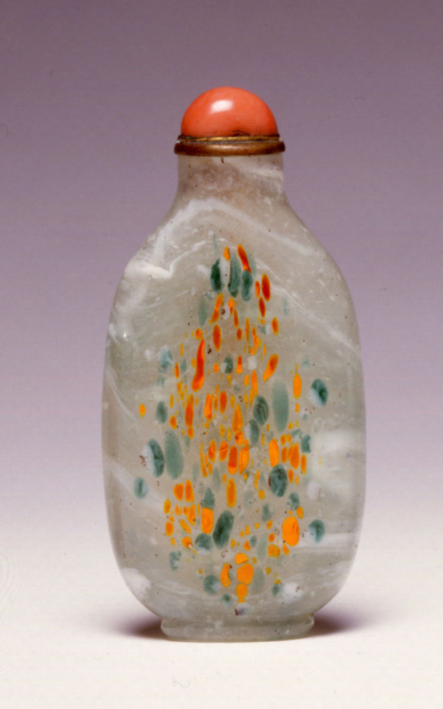 Mottled glass with orange and green splashes