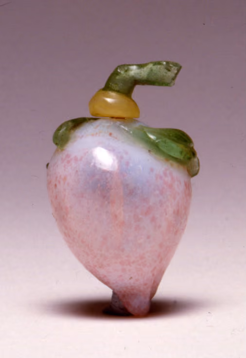 Glass moulded in the form of a peach