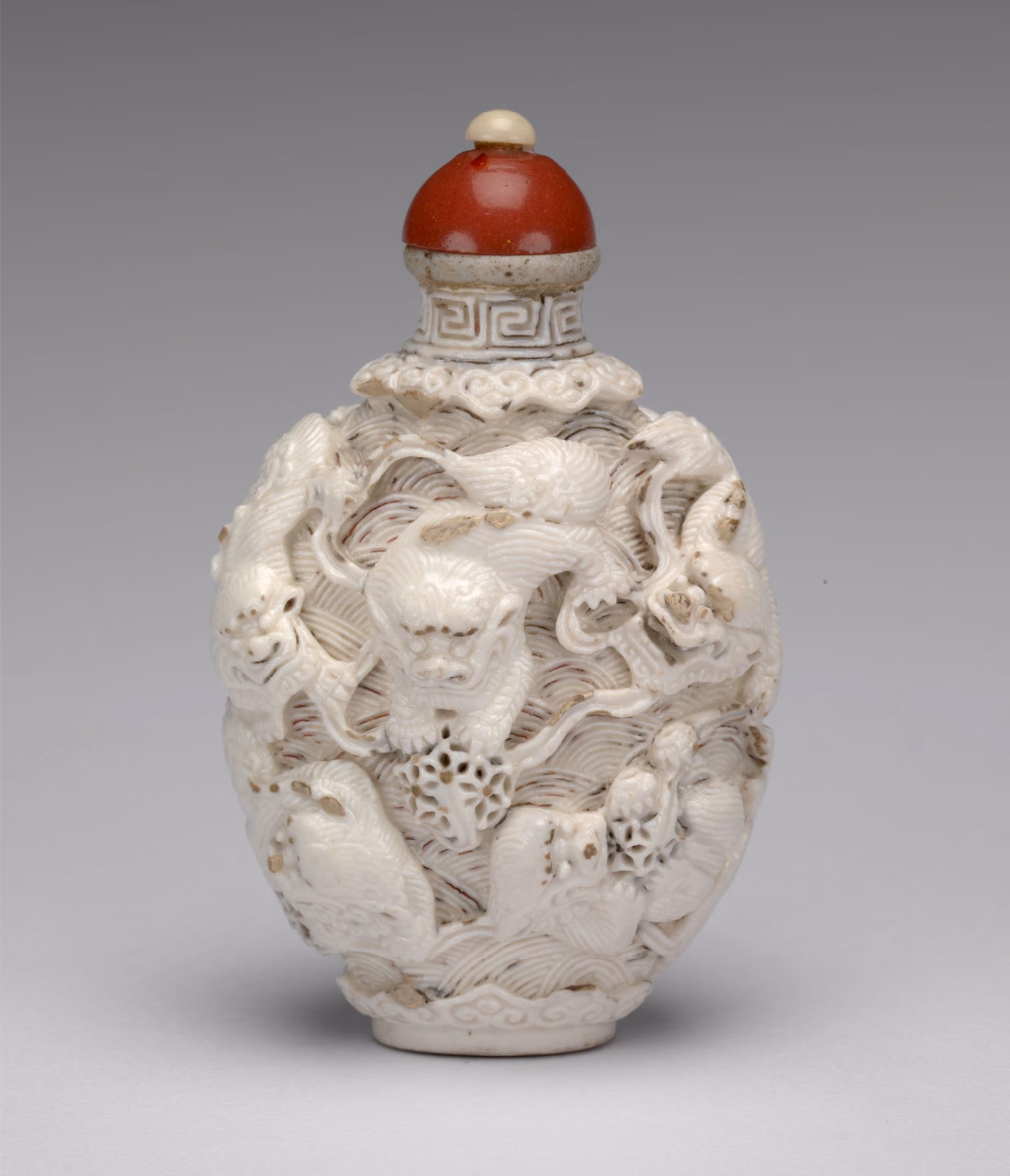 Porcelain moulded with nine lion-dogs