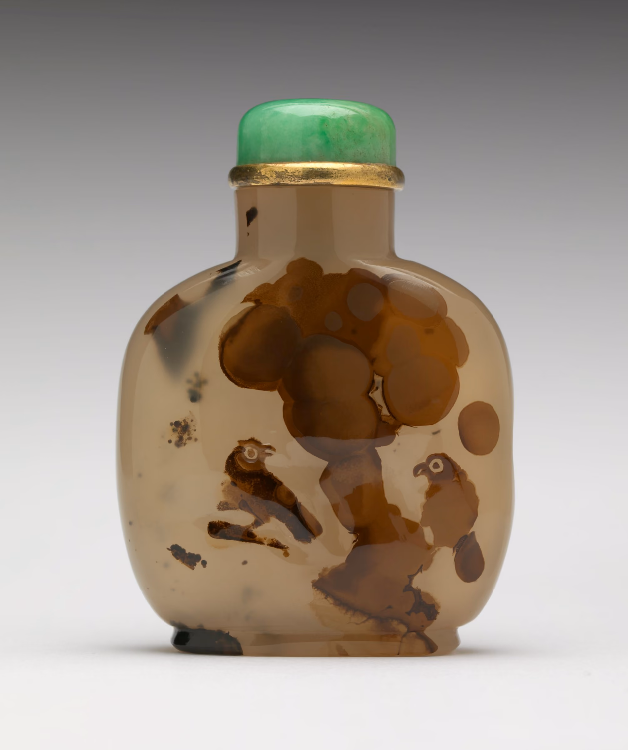 Agate with natural inclusions resembling birds in a tree