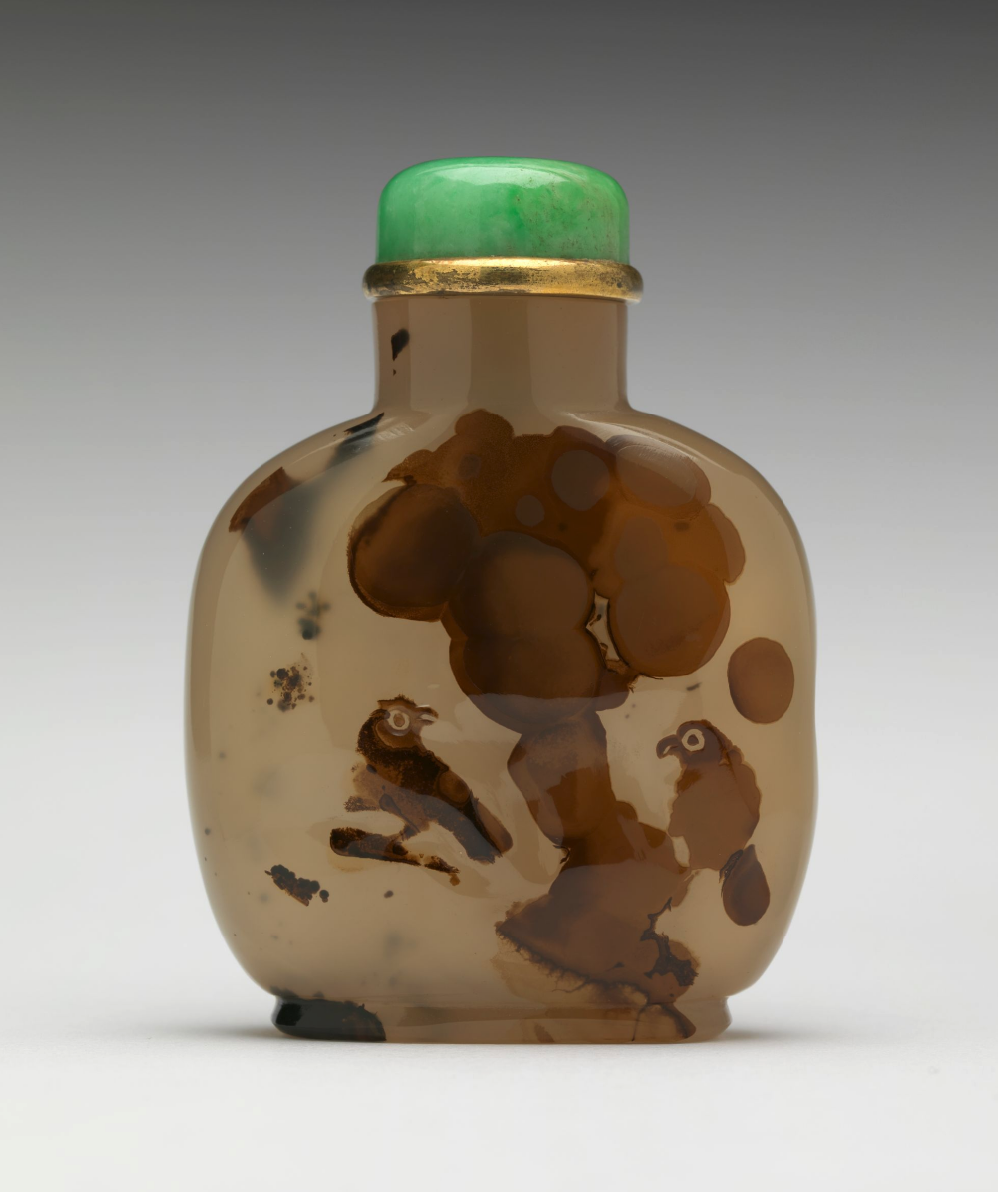 Agate with natural inclusions resembling birds in a tree