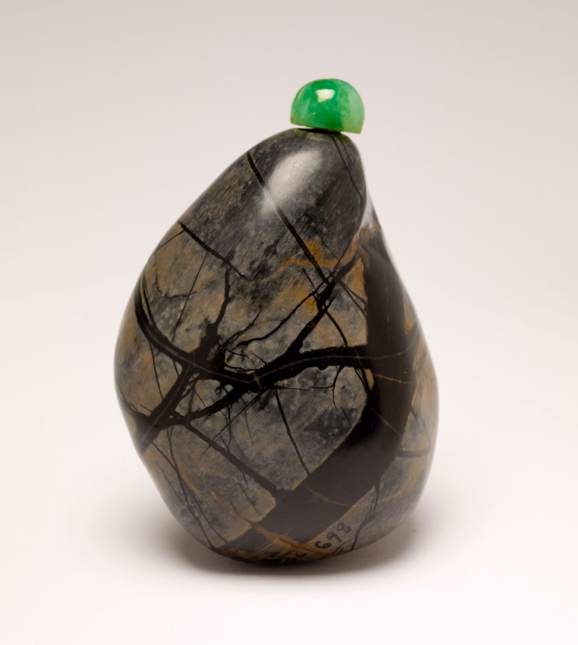 Limestone breccia pebble with jagged inclusions