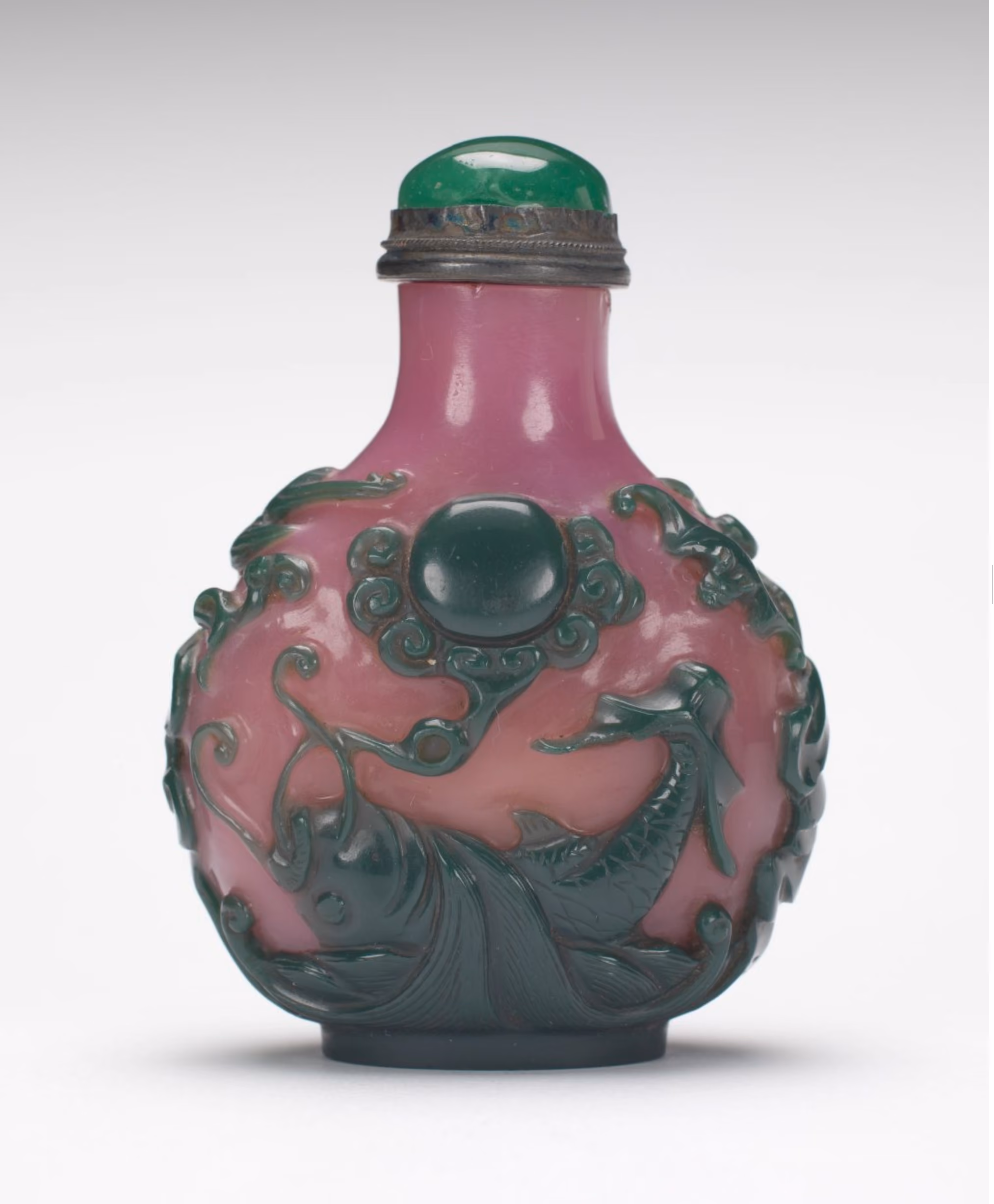 Pink and green glass carved with upturned carp