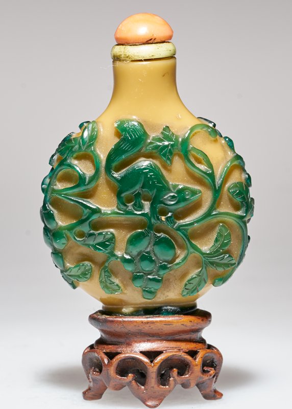 Green overlay glass with squirrel among fruiting vines