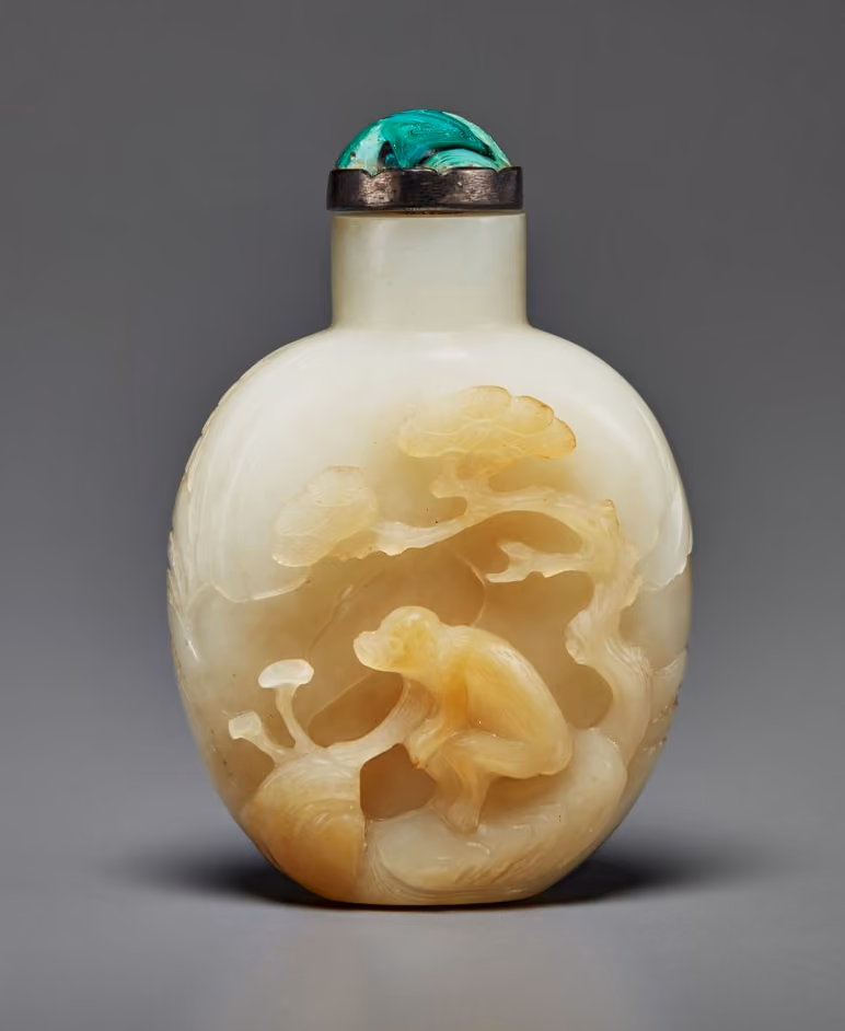 Pale russet and white jade with monkey gathering lingzhi