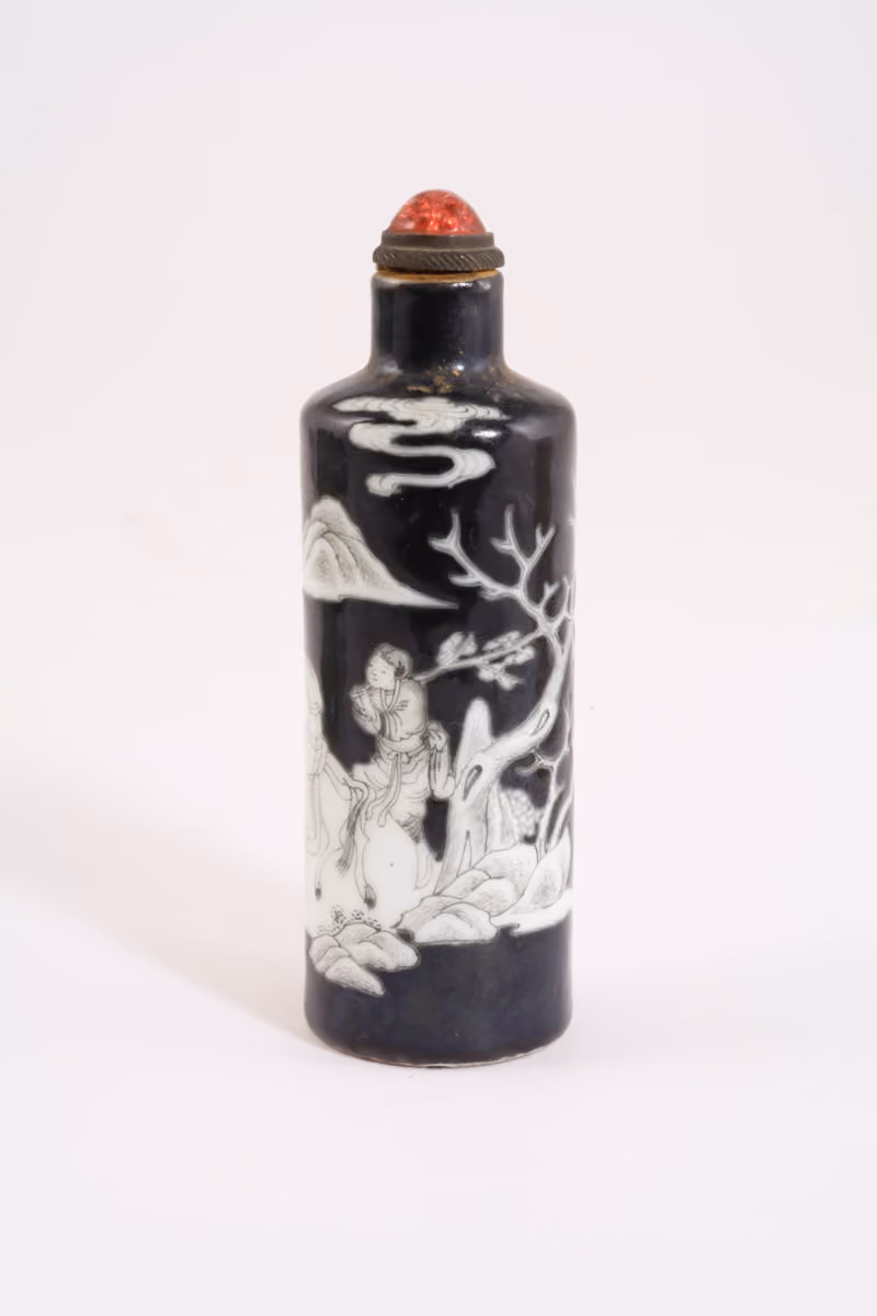 Porcelain with white decor on black ground