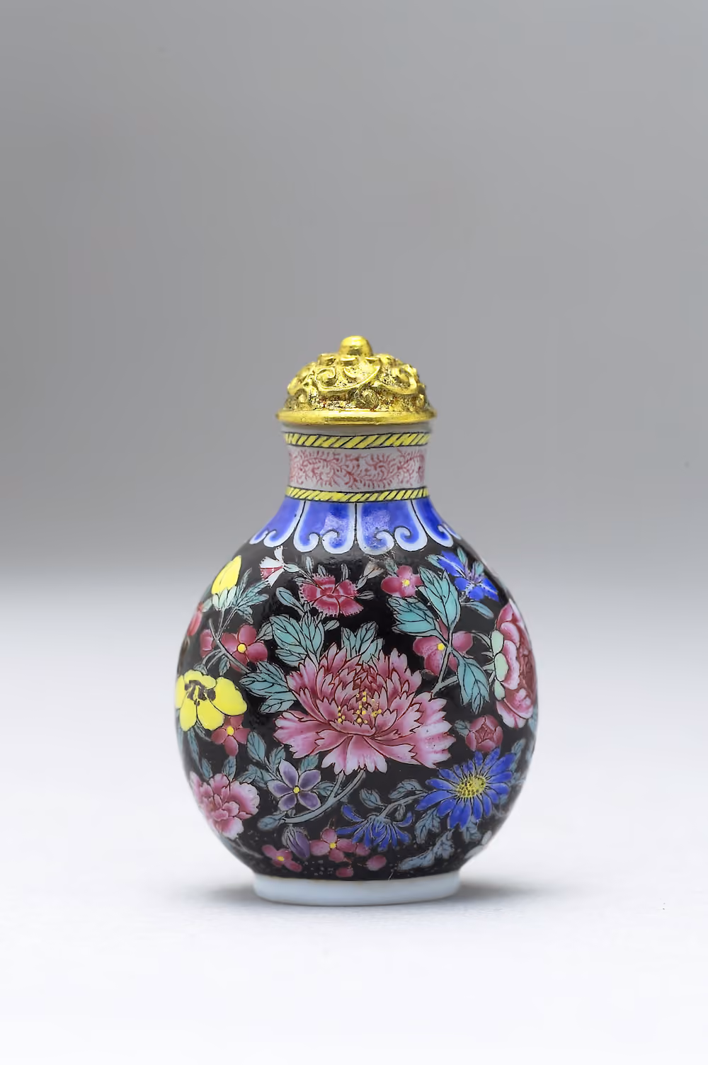 Painted enamel glass with hundred flowers on black ground