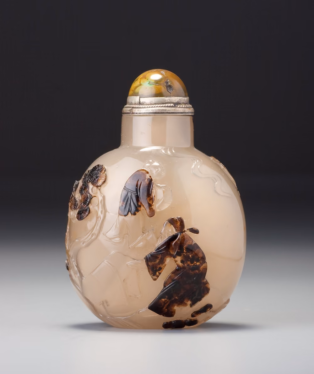 Dendritic chalcedony with scholar in a garden