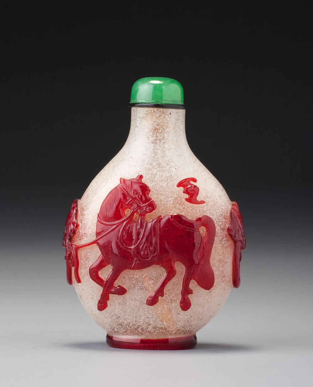 Red overlay glass with horses and bats