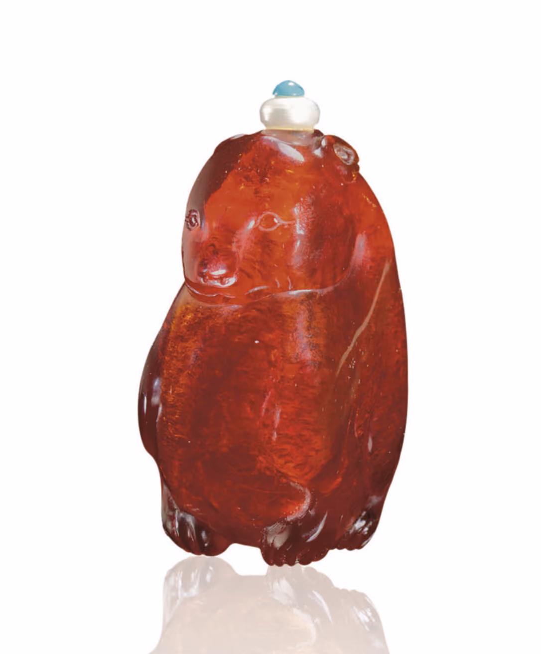 Amber in the form of a seated bear