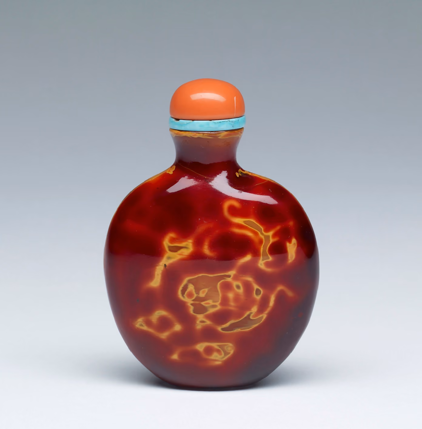 Glass imitating realgar with dragon-like forms