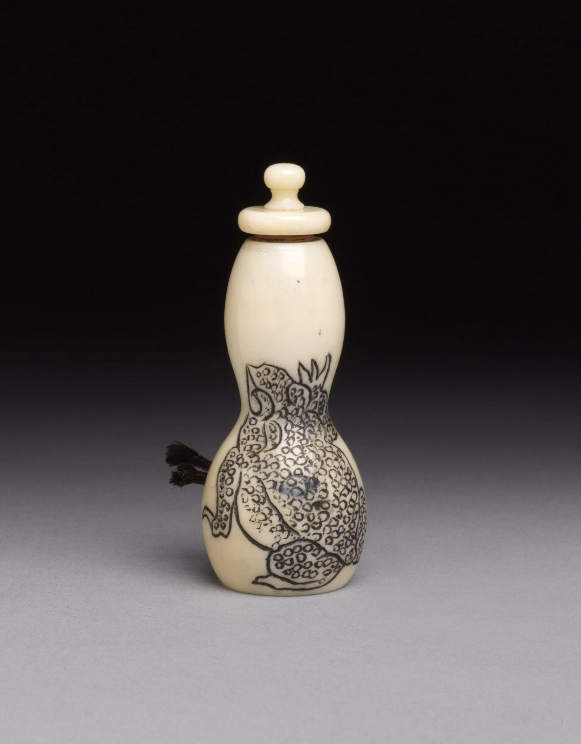 Ivory in double gourd form with frog design in Japanese style
