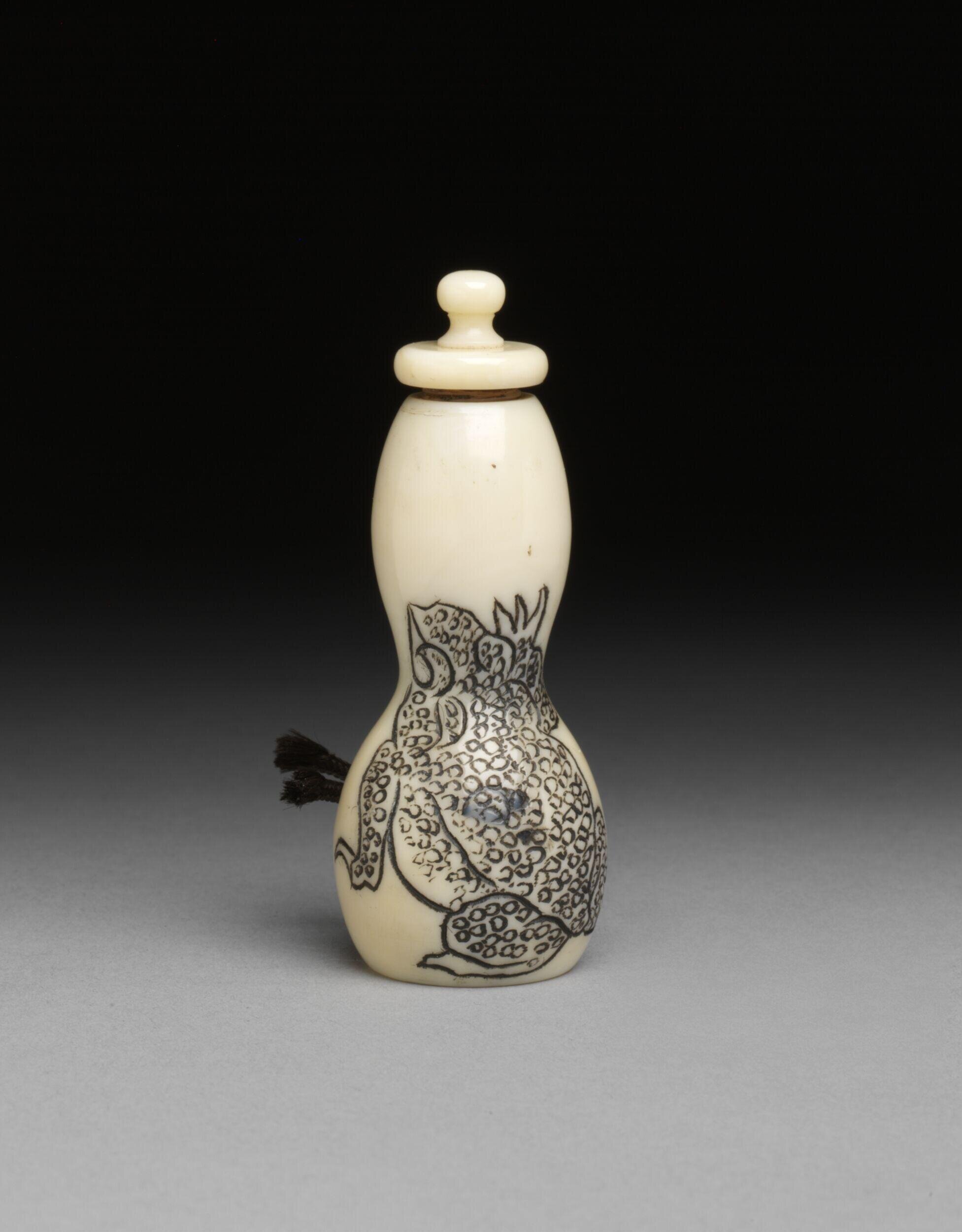 Ivory in double gourd form with frog design in Japanese style
