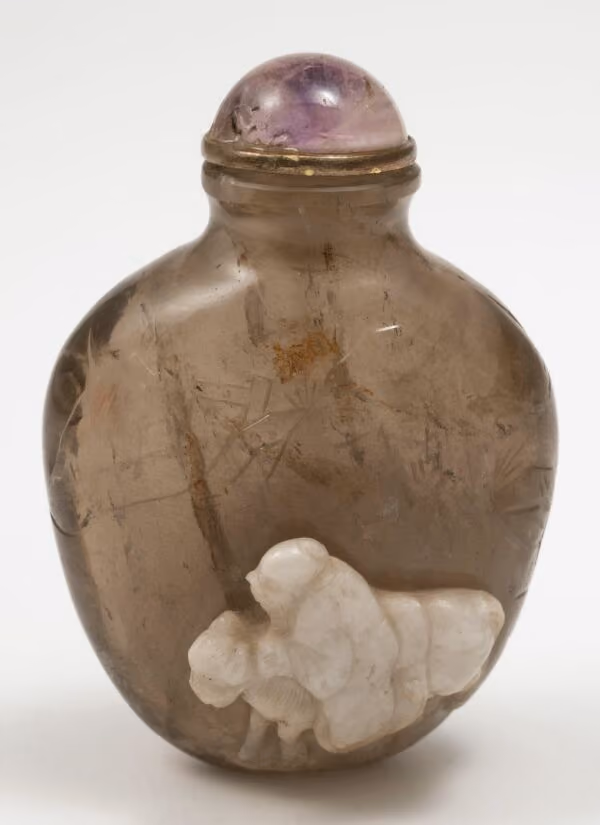 Smoky quartz carved with man on donkey beneath pine tree