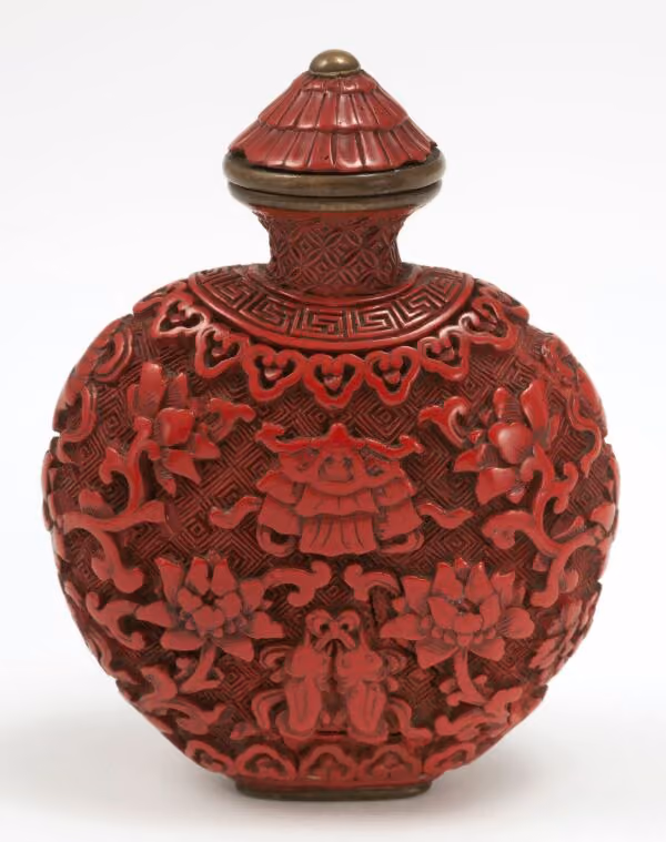 Cinnabar lacquer of spade form carved with flowers